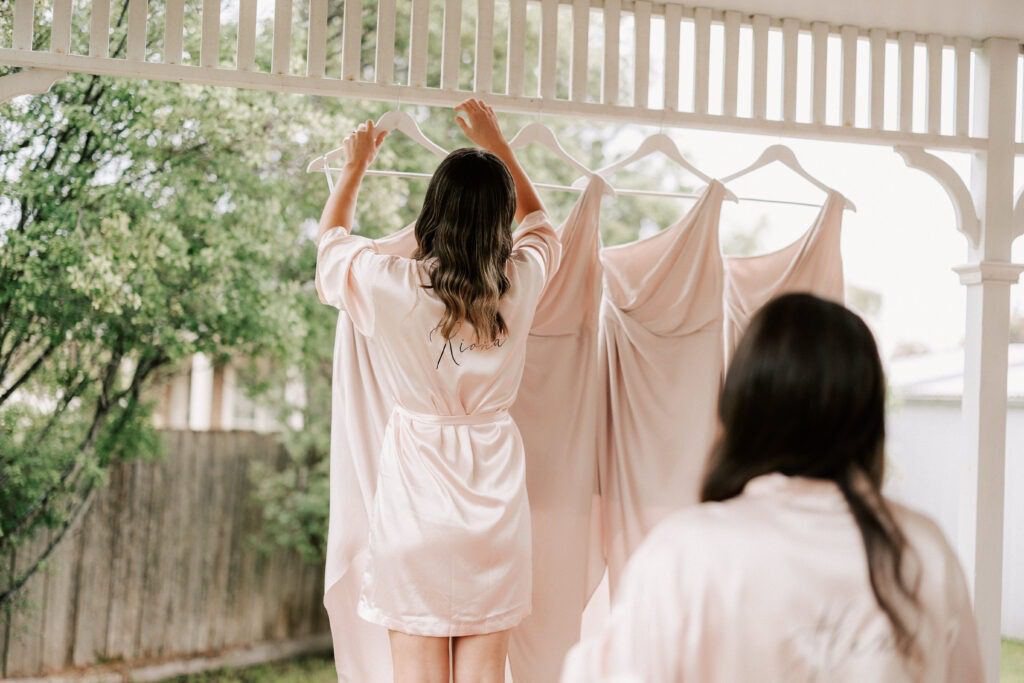 bridesmaid hanging up dress
